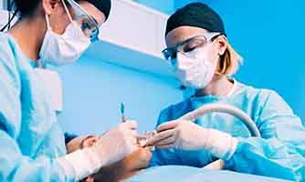 Dentists performing surgery