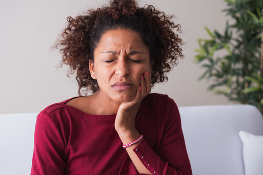 woman with sensitive dental implant